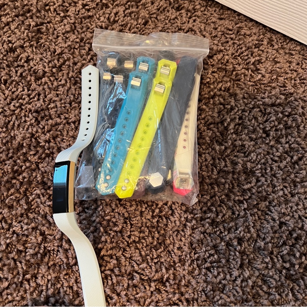 Fitbit with bag of colorful Bands